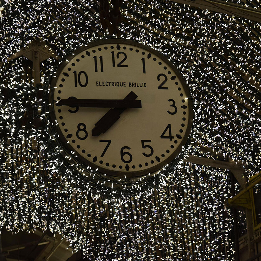 Chelsea Market Clock in New York City with Christmas lights