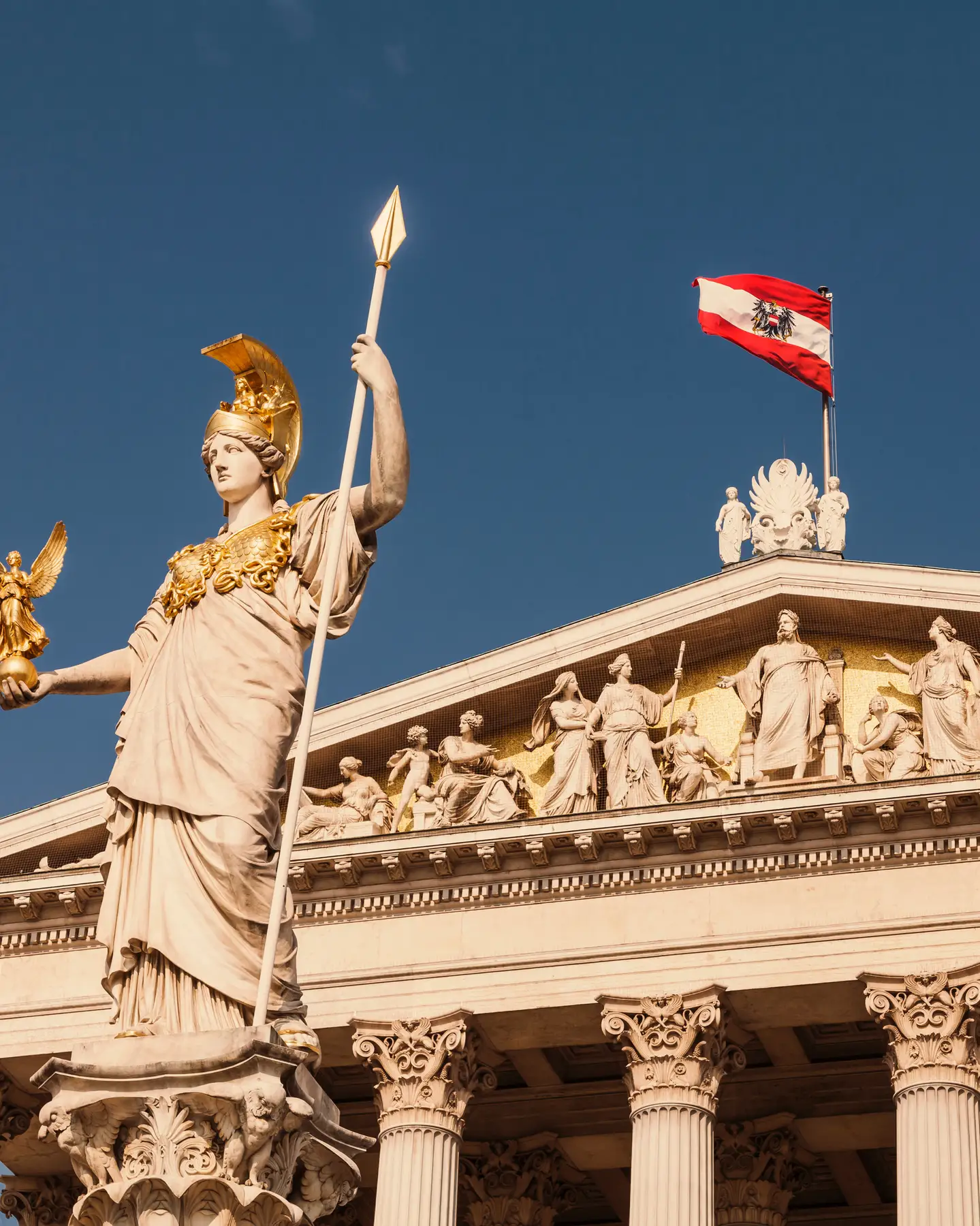 Austria, Vienna, Parliament, National and Federal Council, statue of the goddess Pallas Athena, Austrian flag