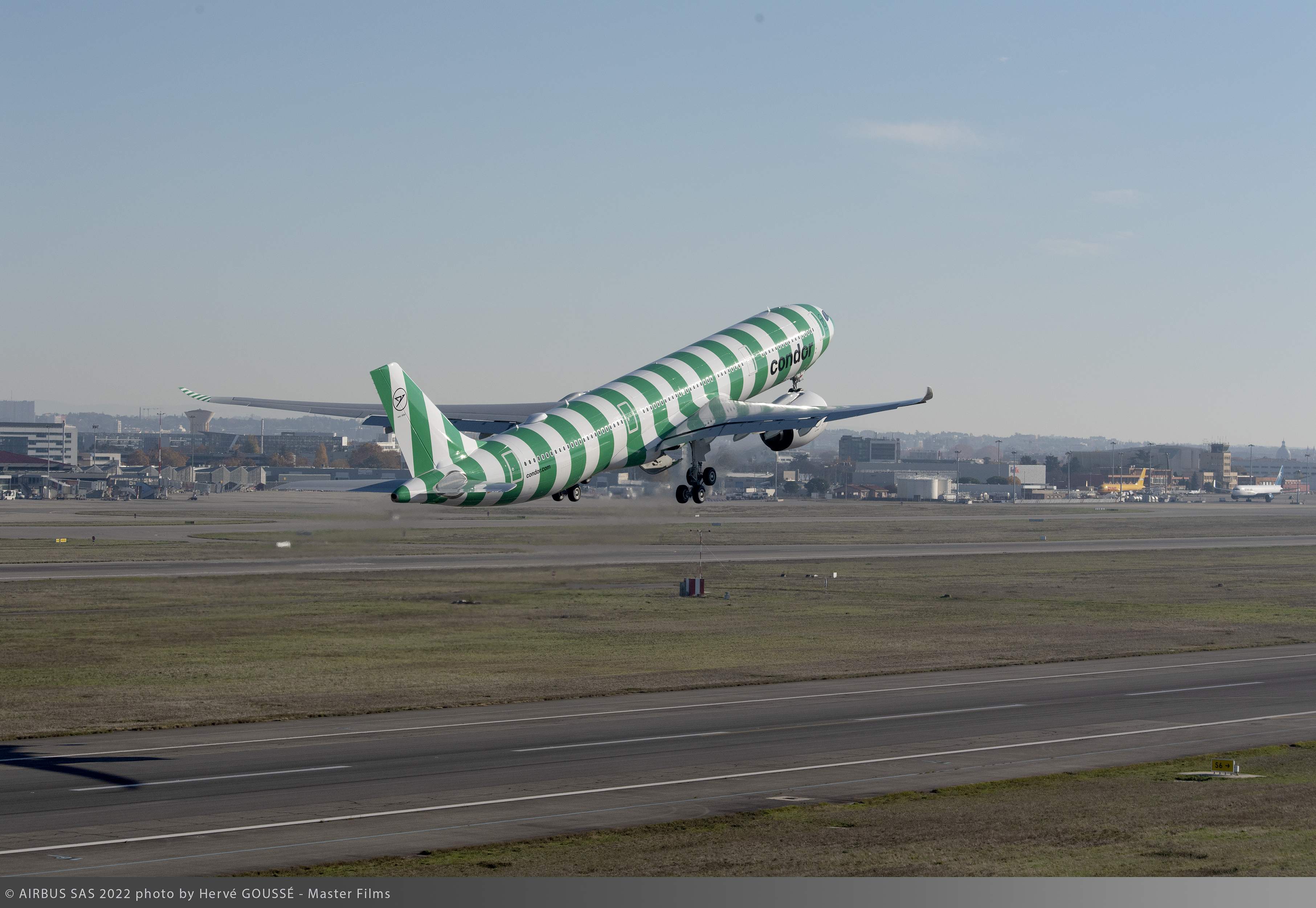 Green-striped Condor A330neo taking off, part of the nature-inspired “Island” paint scheme series.
