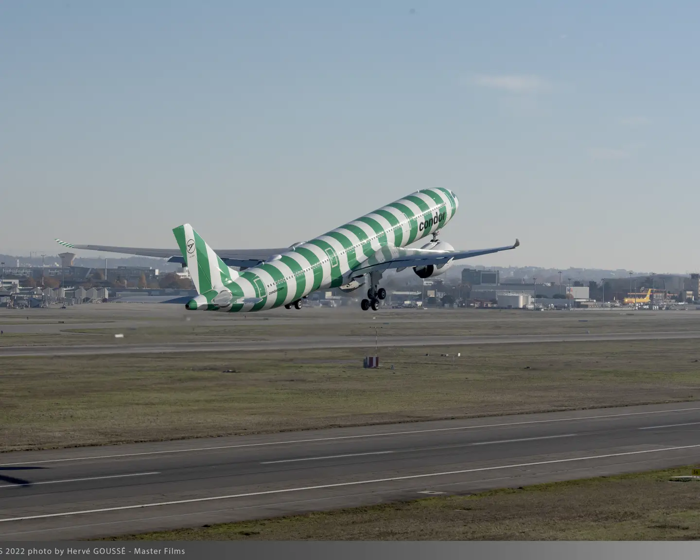 Green-striped Condor A330neo taking off, part of the nature-inspired “Island” paint scheme series.