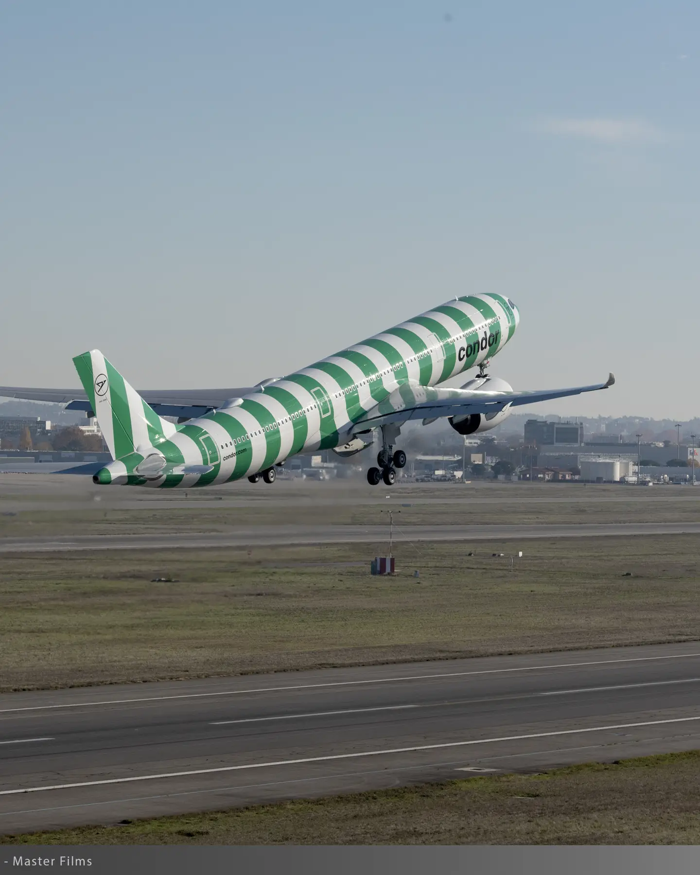 Green-striped Condor A330neo taking off, part of the nature-inspired “Island” paint scheme series.