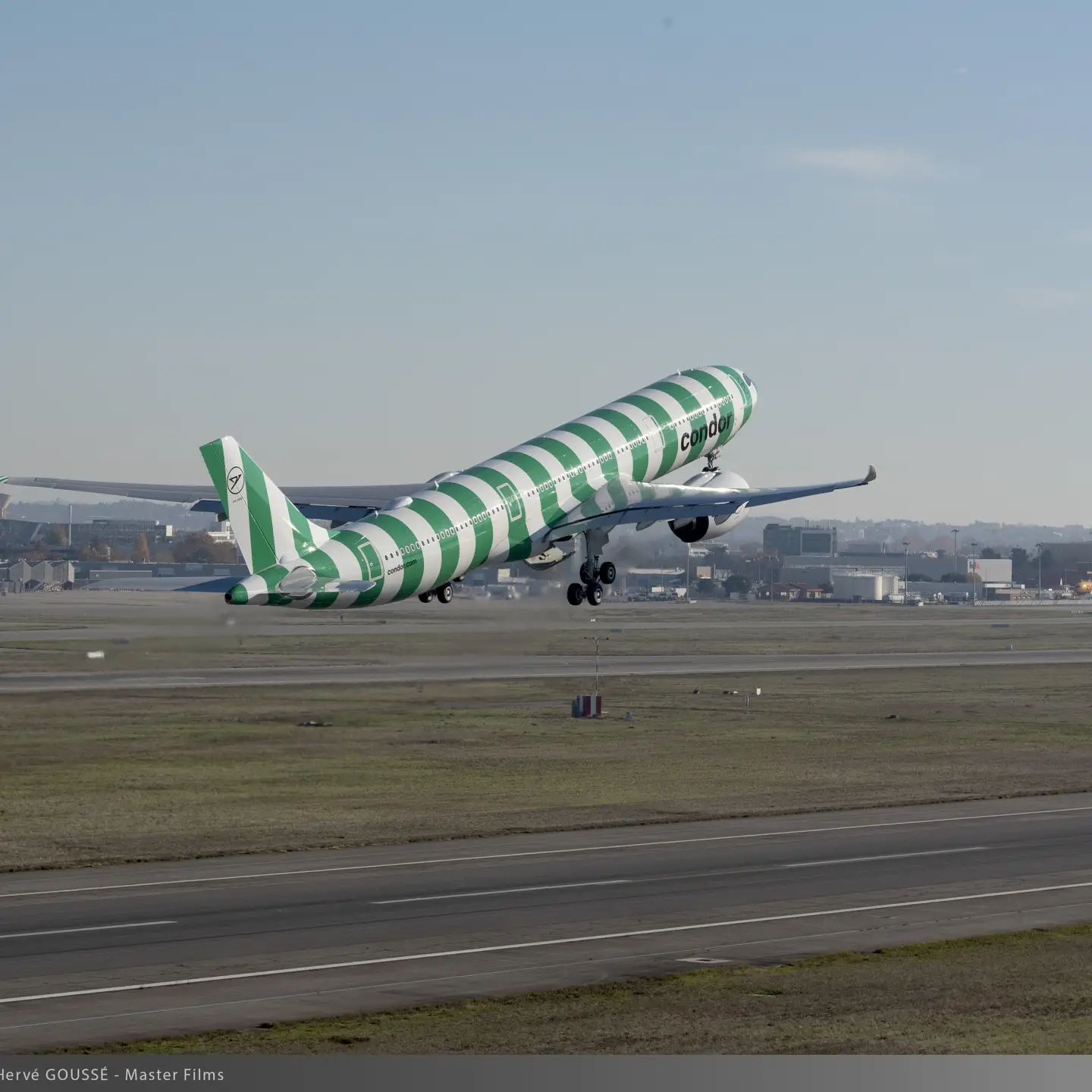 Green-striped Condor A330neo taking off, part of the nature-inspired “Island” paint scheme series.