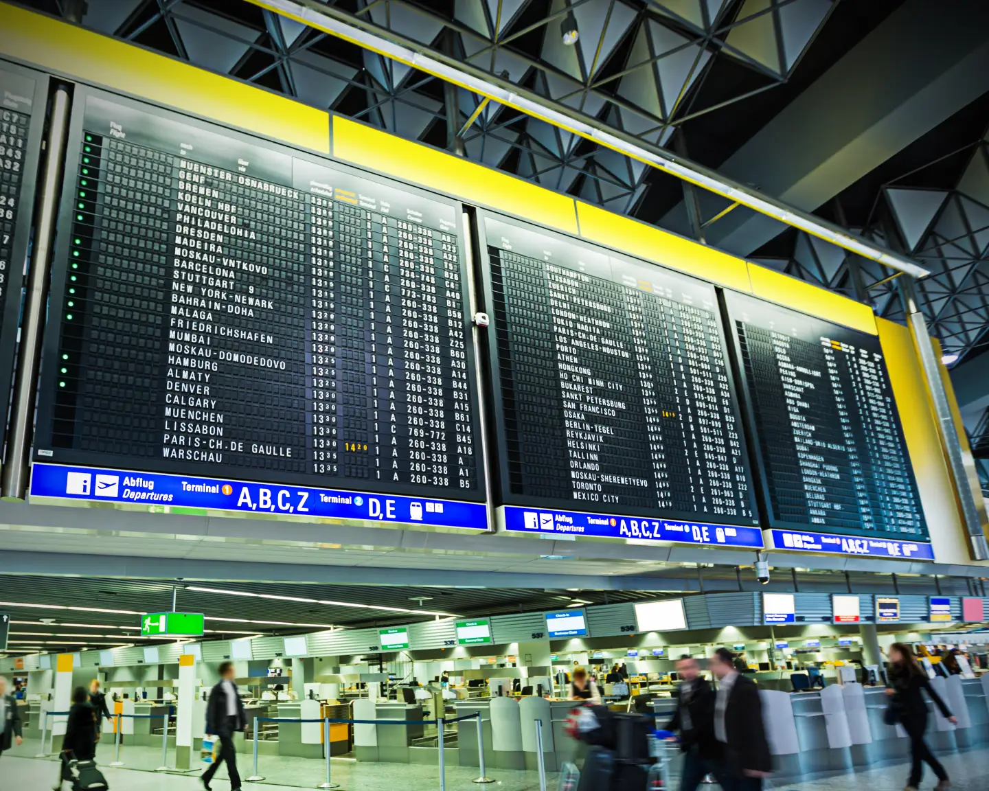  Travelers in the public area at Frankfurt International Airport, Germany's busiest airport. Long exposure.
