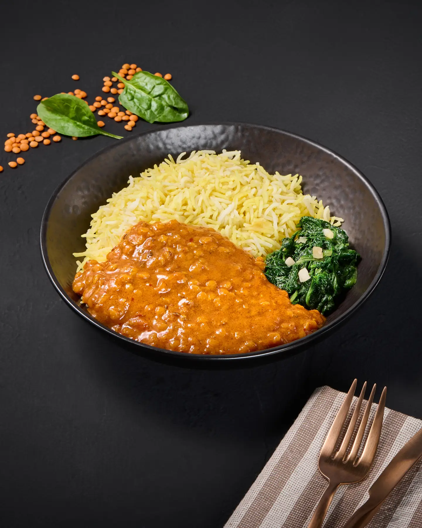 Lentil dal and rice arranged on a plate