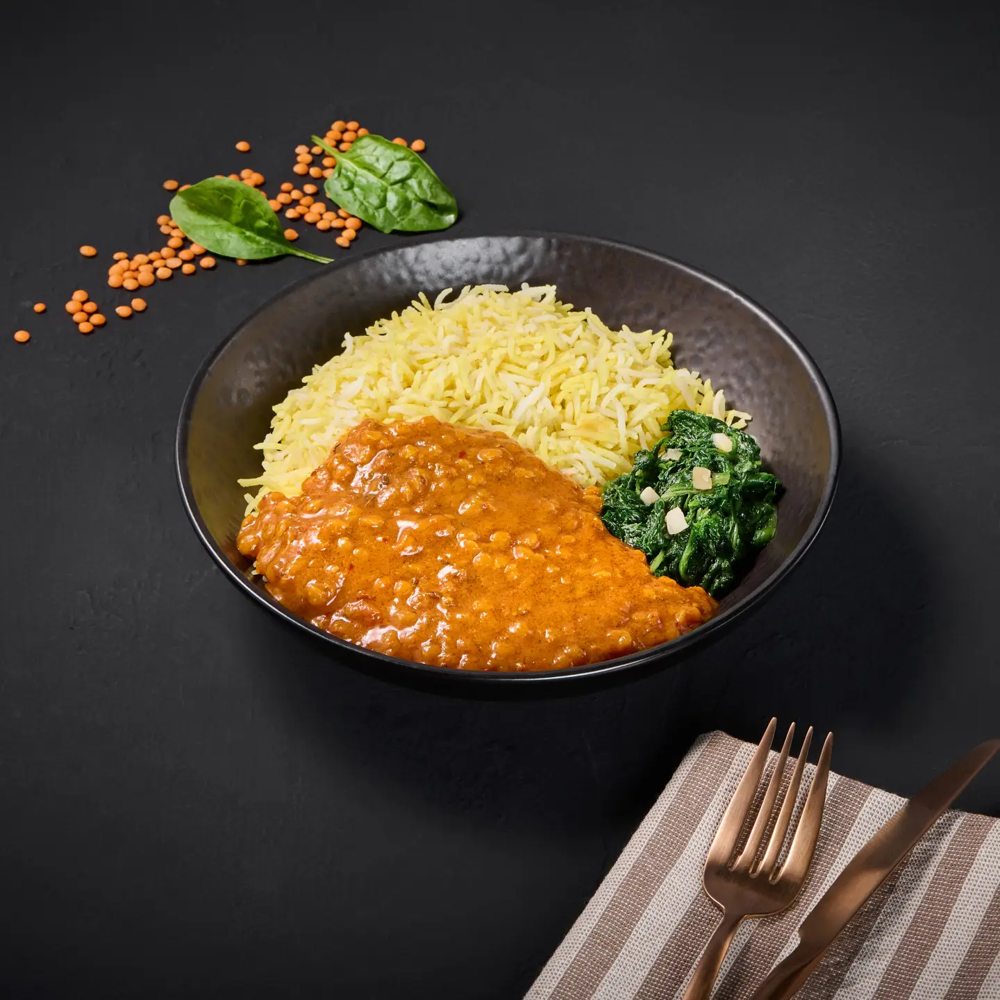 Lentil dal and rice arranged on a plate
