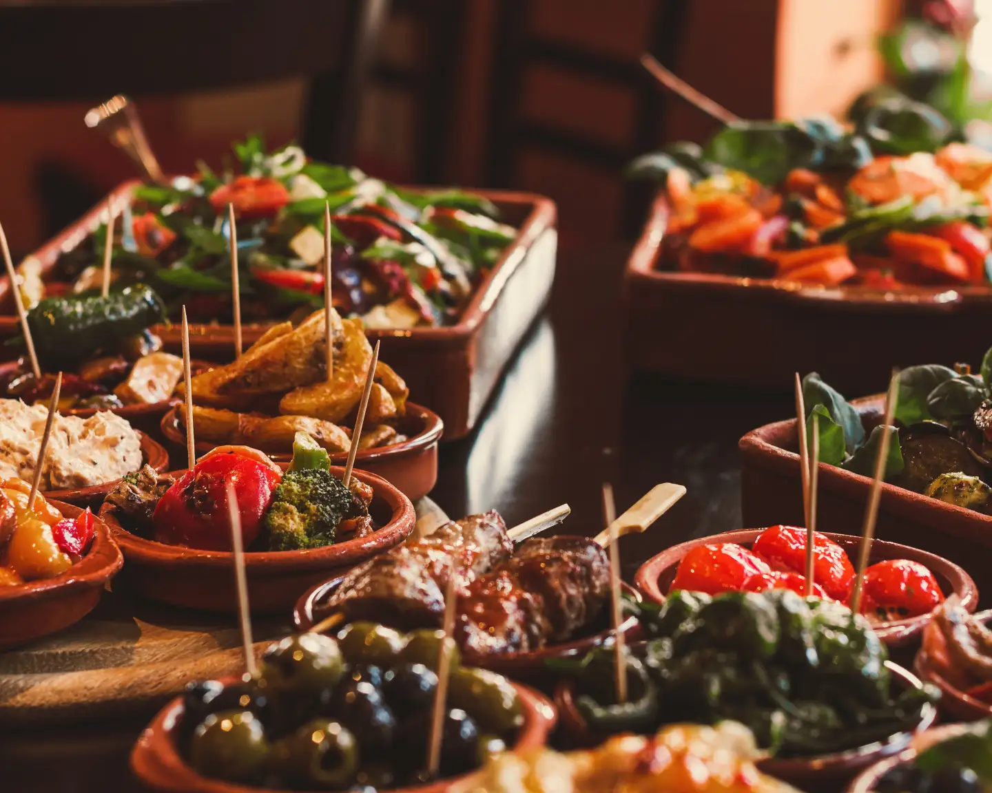Fresh Tapas on location in a Tapas Bar / Restaurant on a black table.