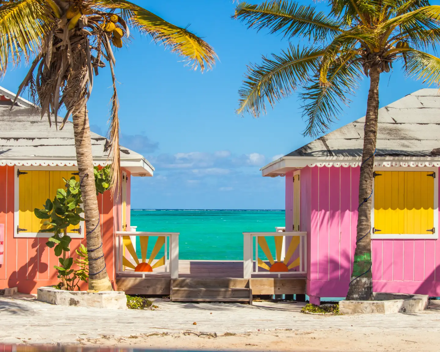 Located in the Blue hills Road neighborhood of Providenciales. Vivid blue of the Caribbean sky and sea with the white sands of Grace bay beach, Turks & Caicos, and bright yellow beach umbrellas. Beautiful beaches, colorful buildings, gorgeous sunrise and sunsets, amazing food, and friendly people Heaven on Earth.