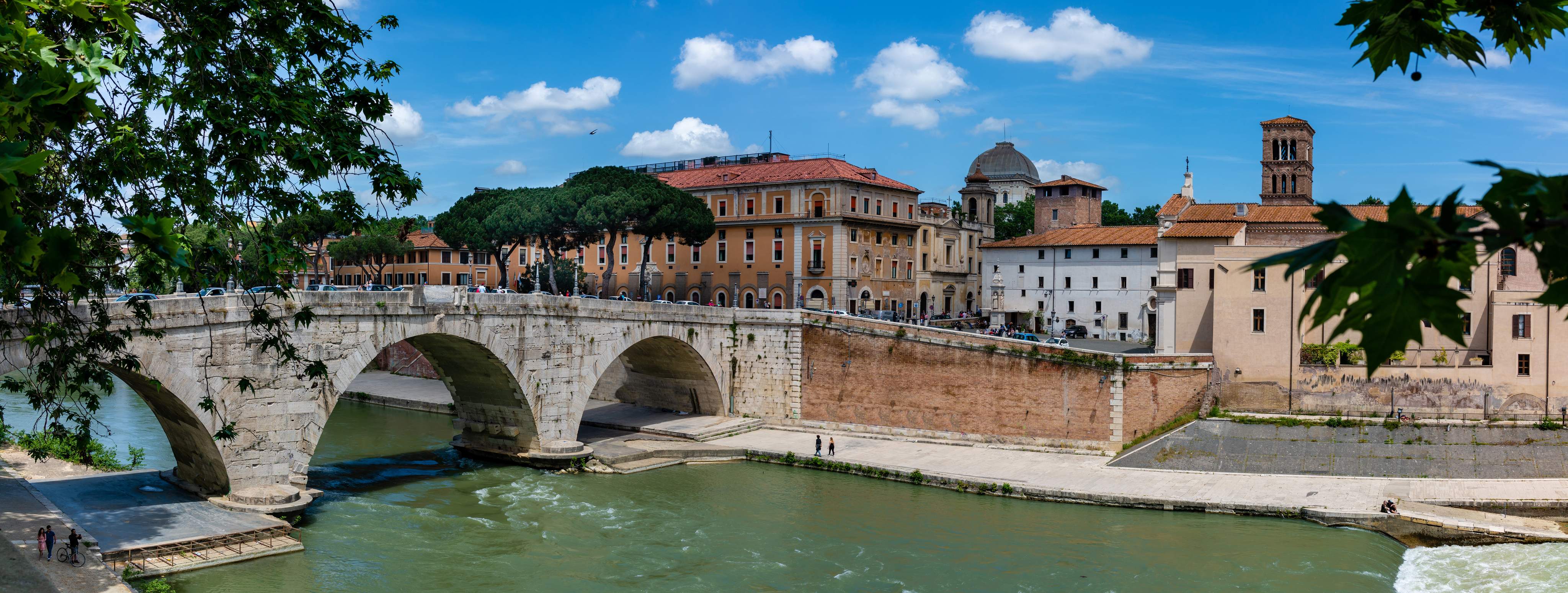 Panoramic view of the bridge over the Tiber with a view of the Trastevere district in Rome, Italy.