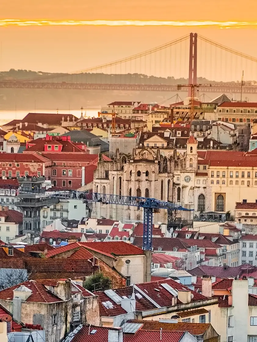 A view of the Alfama downtown and the 25 April Bridge, Lisbon, Portugal.