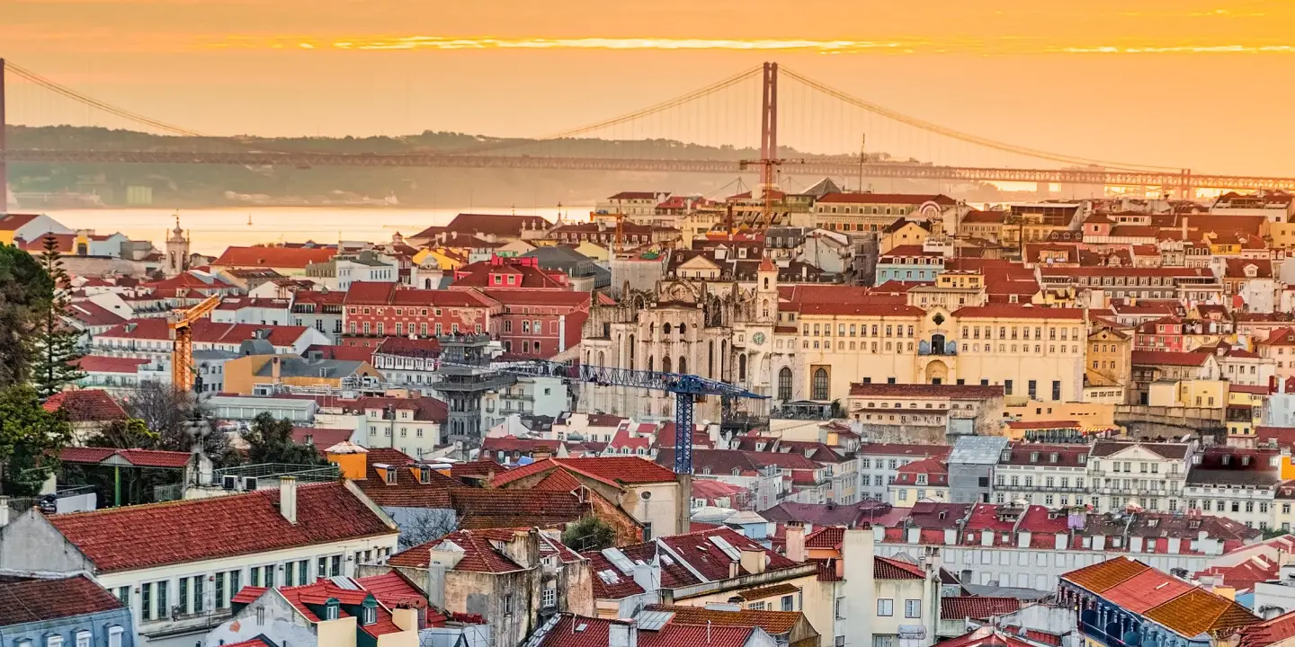 A view of the Alfama downtown and the 25 April Bridge, Lisbon, Portugal.