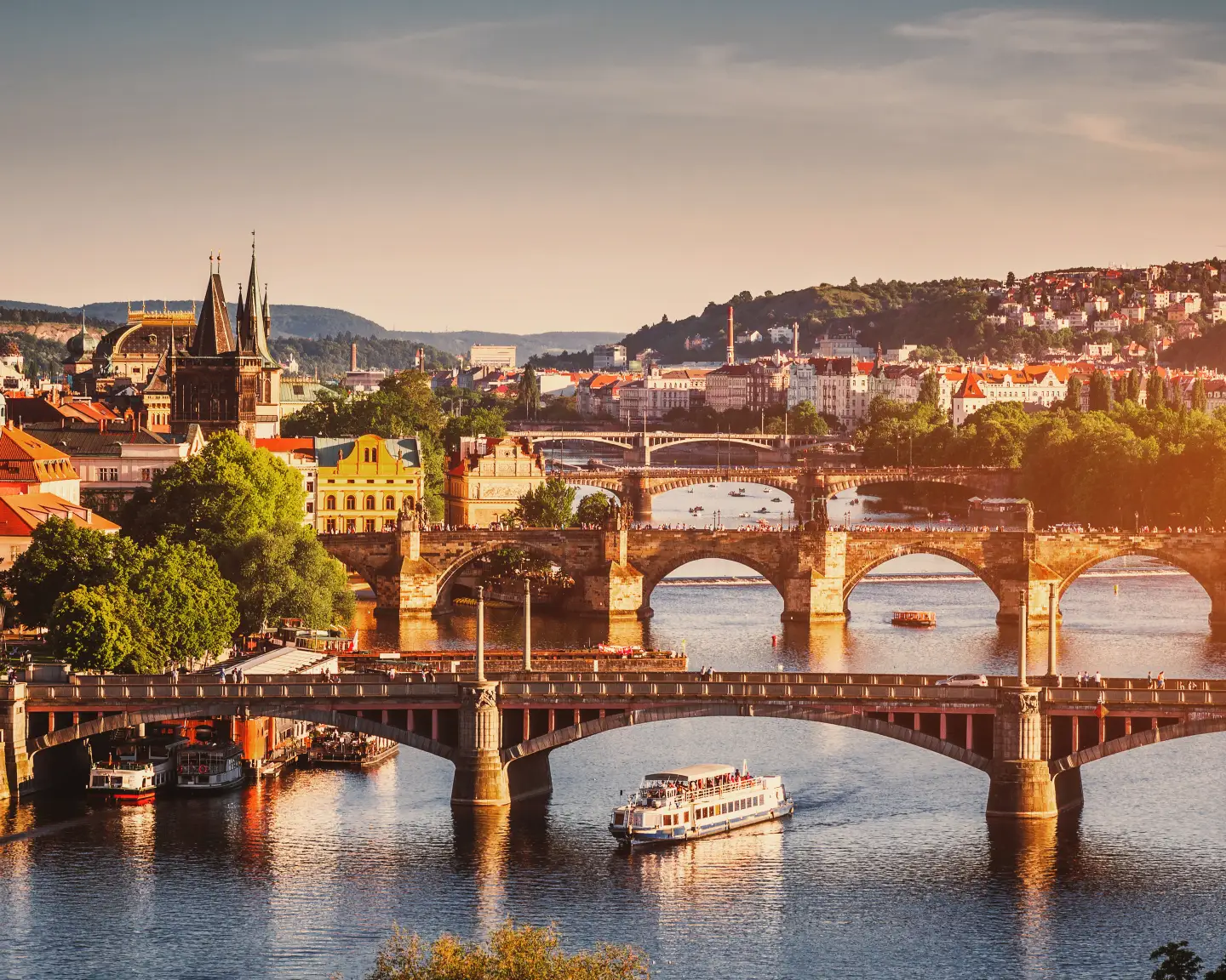 Scenic spring sunset aerial view of the Old Town pier architecture and Charles Bridge over Vltava river in Prague, Czech Republic