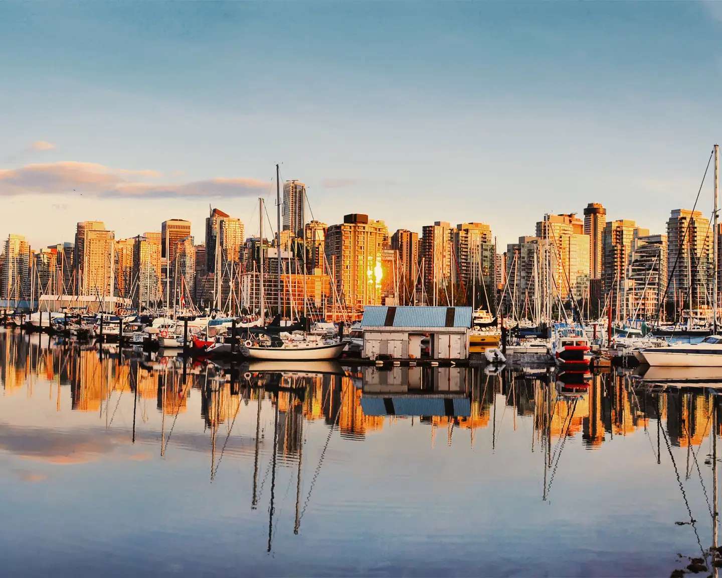 Beautiful view of Vancouver skyline with harbor at sunset, British Columbia, Canada