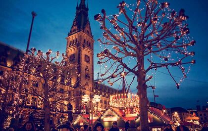 The Christmas Market in Hamburg at night with many lights