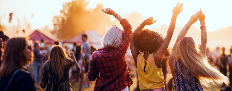 A group of girl friends is celebrating on a festival in Europe