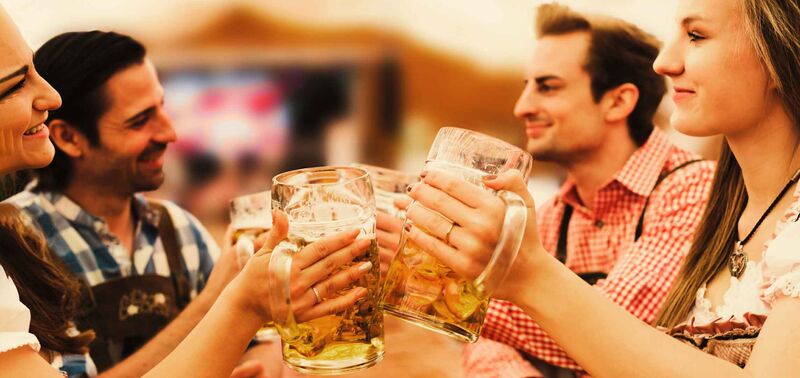 A group of friends enjoying a "Mass" at the famous German Oktoberfest