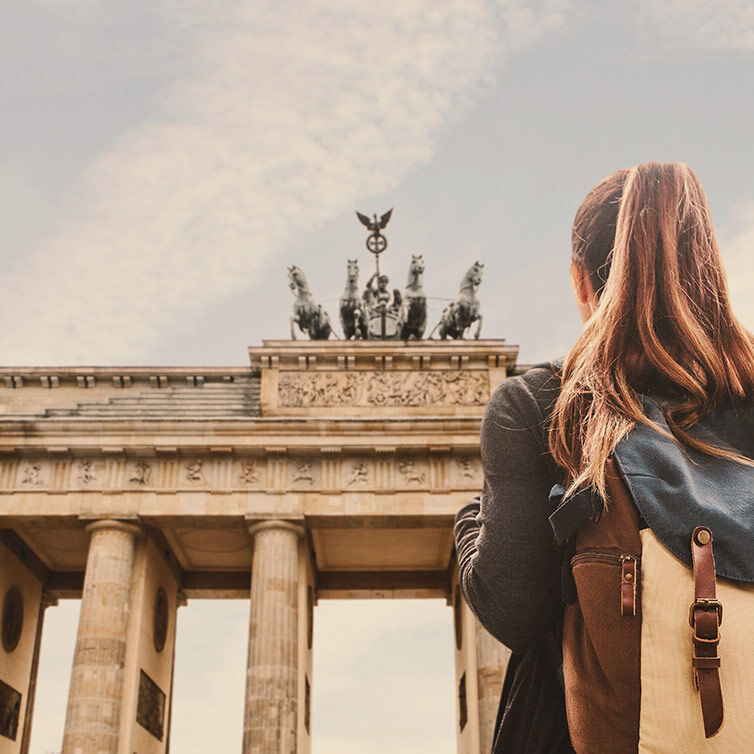 Woman in front of the Brandenburg Gate, in Berlin