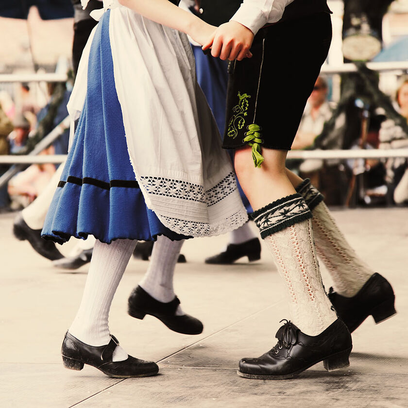Legs of one couple dancing a traditional dance in Munich, Germany
