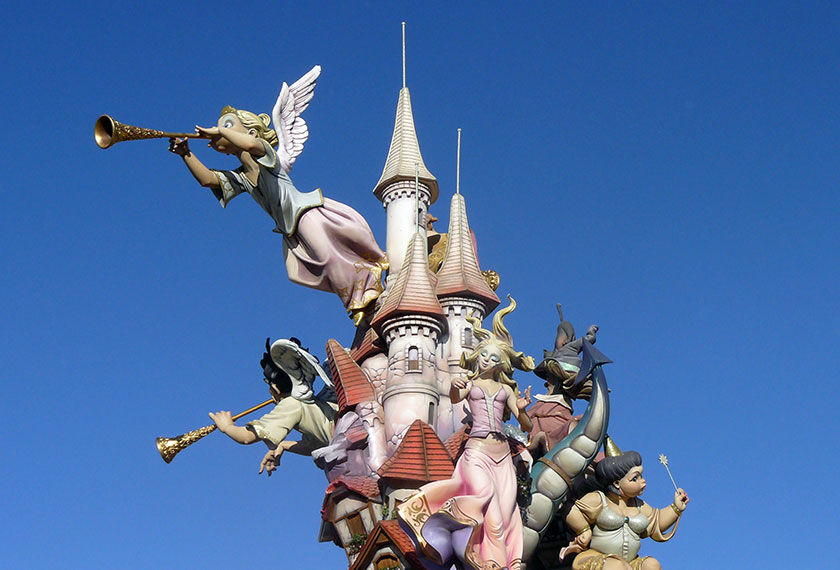 View of one of the Ninots, typical sculptures of the Fallas, over a blue sky.