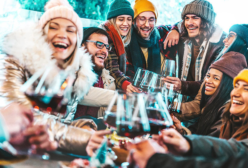Tomorrowland Winter in Alpe d'Huez, France Group of friends cheering with wine glasses at the Tomorrowland Winter Festival in Alpe d'Huez, France.