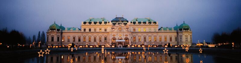 Nightly view of Schönbrunn Palace and its Christmas Market in Vienna, Austria