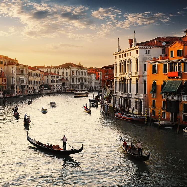 A typical scene from the Canal Grande in Venice, Italy, with colorful buildings and gondolas