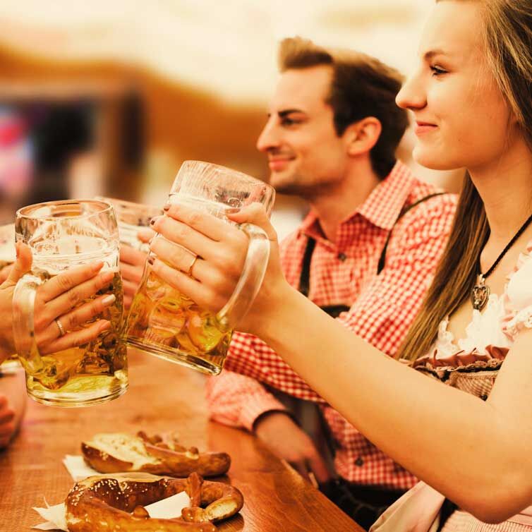 A couple enjoying a Mass at Oktoberfest