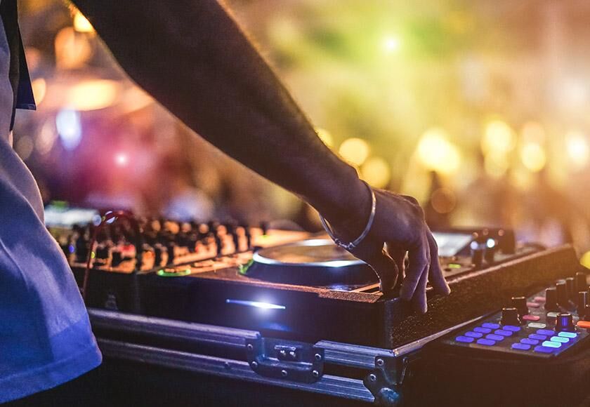 Flights to Prague (PRG) DJ playing in a party