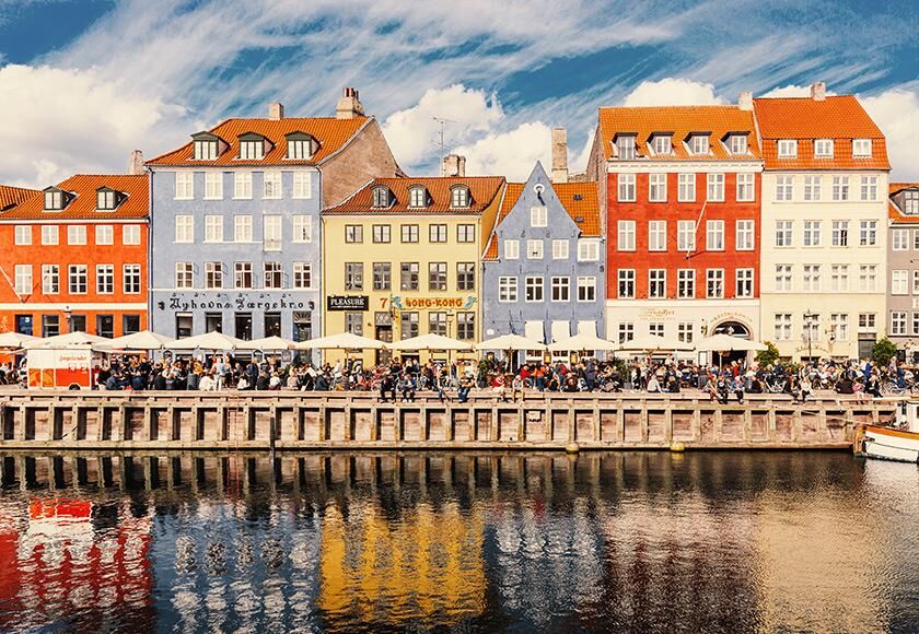 Colorful historic buildings along the Nyhavn waterfront in Copenhagen
