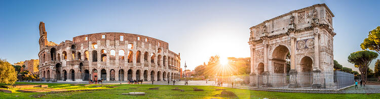 Beautiful panoramic view of the Colosseum and the Arch of Constantine in Rome at sunrise
