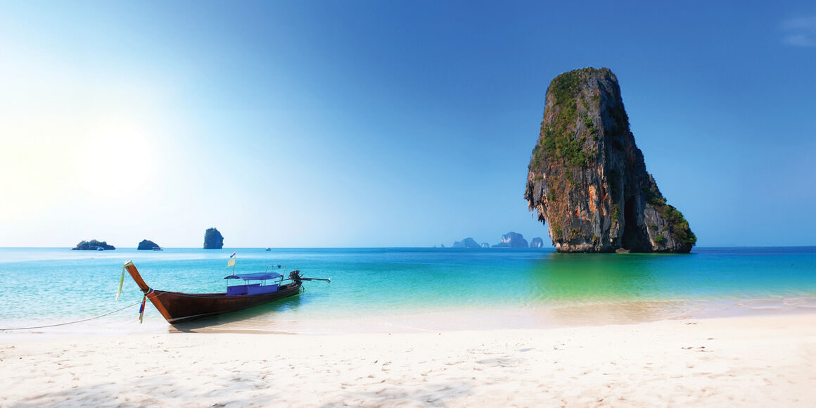 Phuket Beach in Phuket with boat in the front