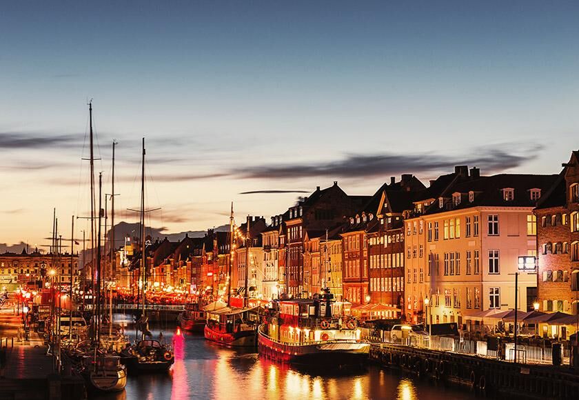 Lively evening streetscape with illuminated buildings